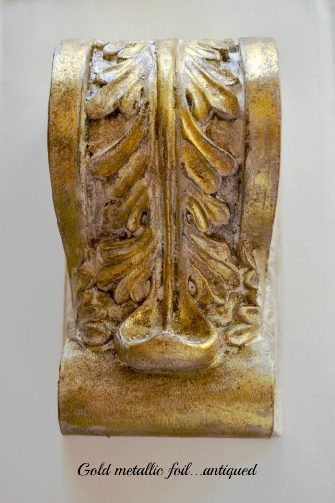 Antiqued metallic foil on an ornate molding