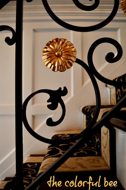 closeup of wrought iron and gold medallion