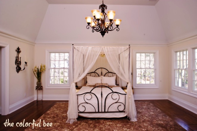 a painted canopy bed in a staged home in Muttontown NY
