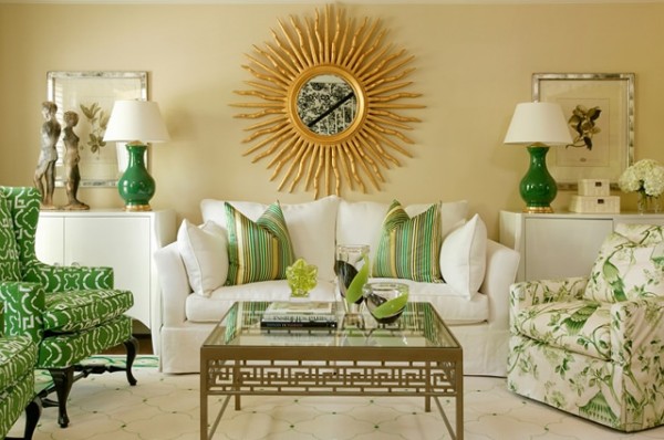 living room with neutral walls and pops of green