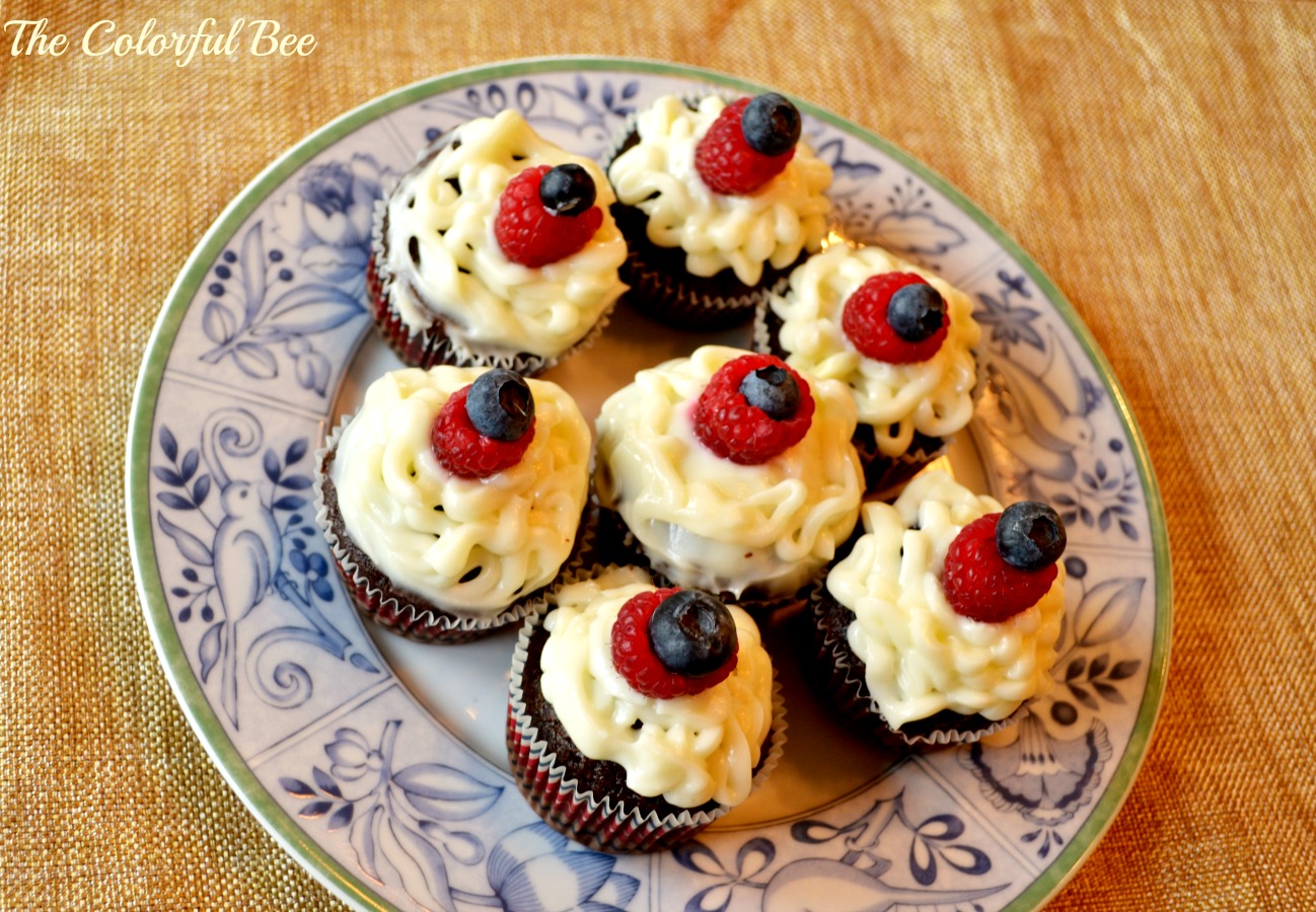 devil's food chocolate cupcakes with cream cheese icing and blueberry and rasperry decoration
